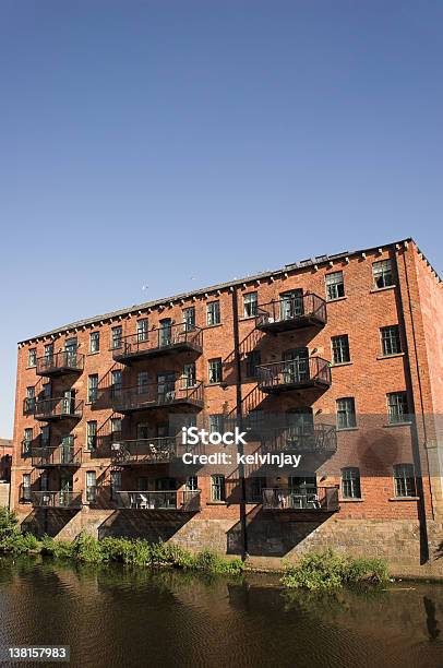 Converted Warehouse Flats By The River In Leeds Stock Photo - Download Image Now - Change, Warehouse, Apartment