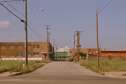 an empty lonely street with no cars or street signs on the ouskirts of Dallas in the South West USA