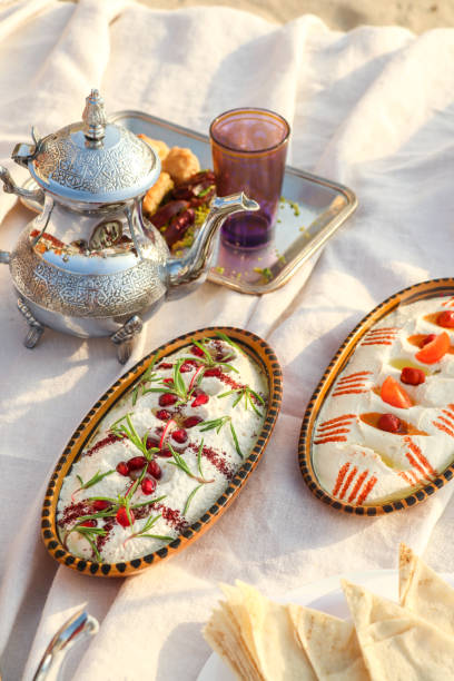 istock Arabic Meze Hummus appetizer plate with olive oil and bread 1381581454