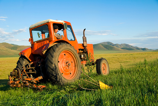 Tractor and Farmer, Mongolia, Asia.