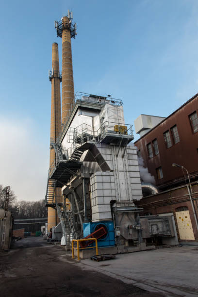 istock Two industrial chimneys with  brick 1381638571