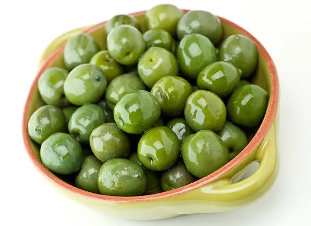 Italian Green Cerignola Olives on white background (this picture has been shot with a 31 megapixels Hasselblad HD3 II camera)