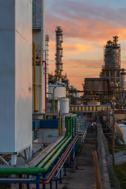 istock Pipelines in an oil refinery at sunset. 1381659730
