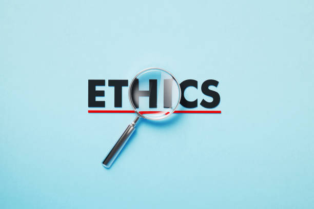 istock Magnifier Forming Ethics Word On Blue Background 1381661616