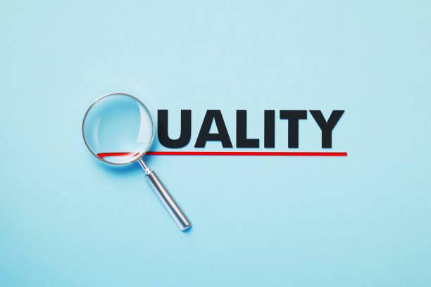 istock Magnifier Forming Quality Word On Blue Background 1381664564