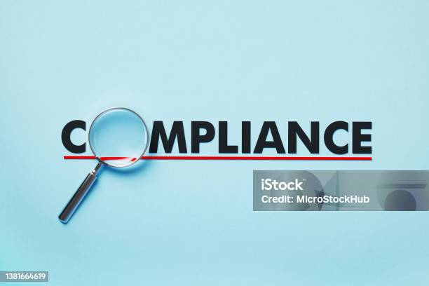 Magnifier Forming Compliance Word On Blue Background Stock Photo - Download Image Now
