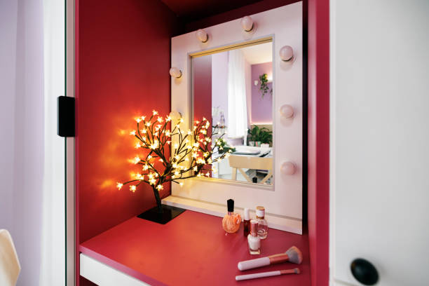 Modern luxury teenage girl's bedroom with desk and lot of plants. Closeup of make up mirror.Canon R5.