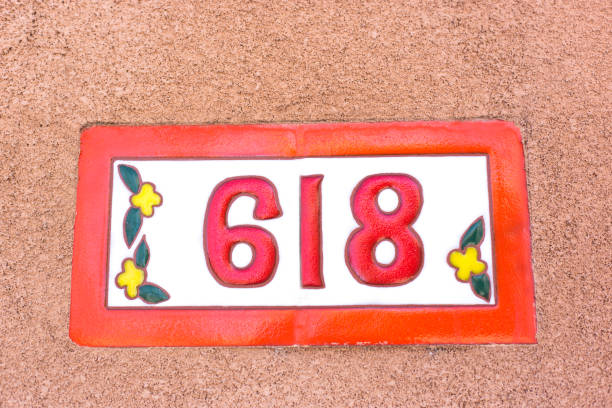 istock Orange and White House Address Number: 618 1381685730