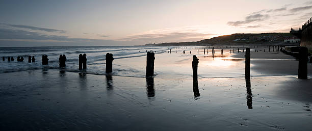 Breakwaters on the Beach at Sandsend near Whitby, North Yorkshire stock photo