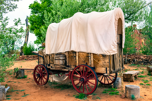 Covered Wagon like those used when people travel to settle the Western United States.