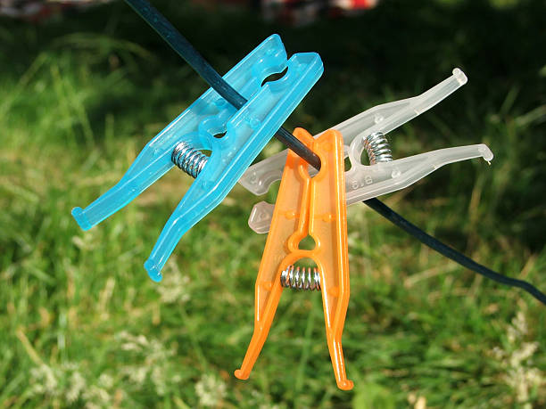 istock Blue, orange, white clothes pegs 138171279