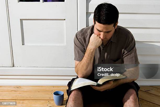 Man Thinks As He Reads The Bible Stock Photo - Download Image Now - 30-39 Years, Adult, Adults Only