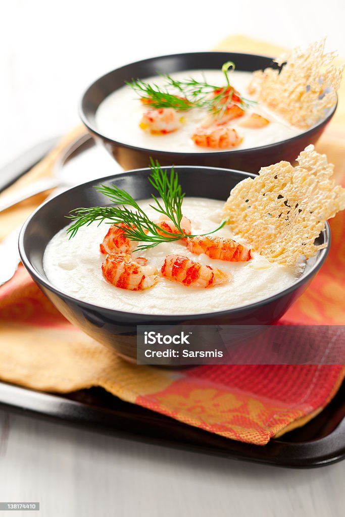 Cream of potato and celeriac soup Cream of potato and celeriac soup with crab meat and parmesan crisps Appetizer Stock Photo