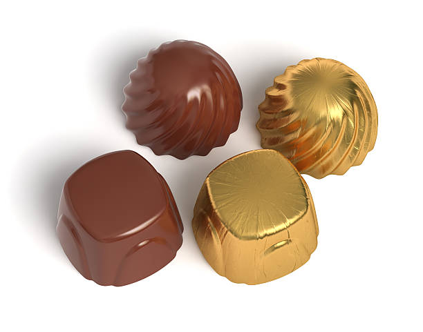 Chocolate sweets with golden wrapper stock photo