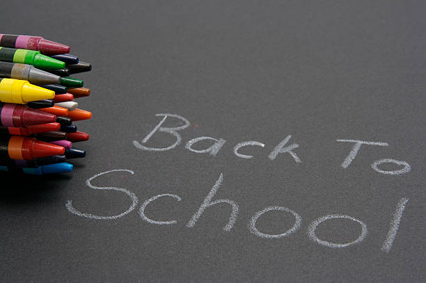 Back to school sign with crayons stock photo