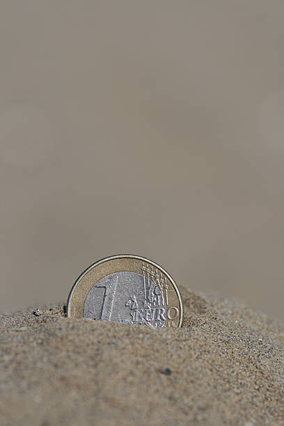 istock Euro in the sand 138174866