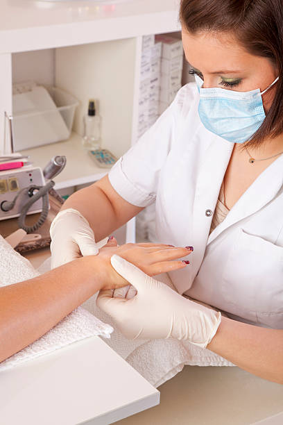 istock nail designer giving skin care 138176328