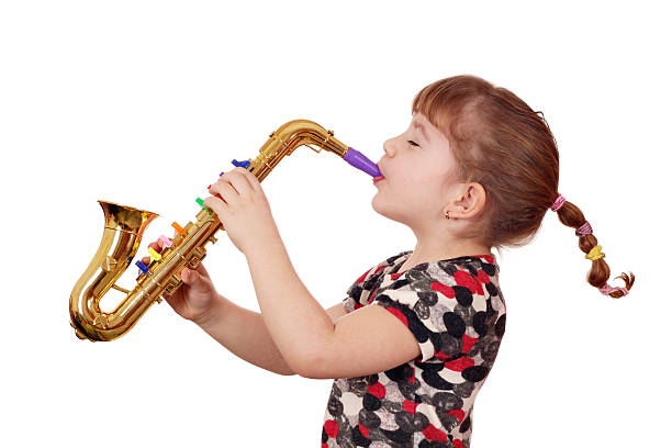 istock little girl play saxophone 138176460