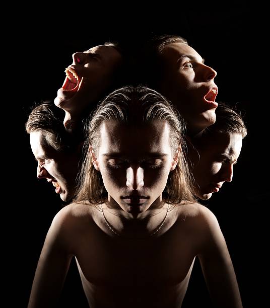 Many faces symbolizing different emotions or multiple personalities.
