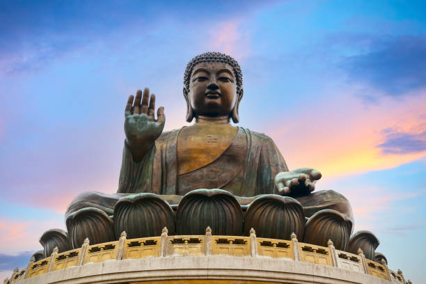 Big Buddha near Po Lin Monastery in Hong Kong The Big Buddha near Po Lin Monastery in Hong Kong  - symbol of the harmonious relationship between man and nature, people and faith buddha stock pictures, royalty-free photos & images