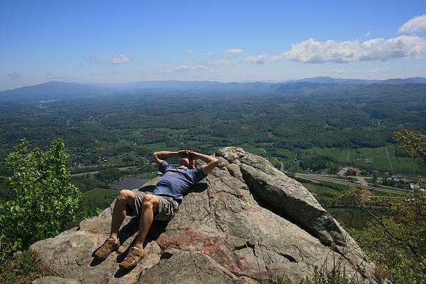 Buffalo Mountain Overlook After a 3 mile hike to the top of Buffalo Mountain in Washington Co, TN, the reward is a sun bath and a beautiful view from 'white rock'. johnson city tn stock pictures, royalty-free photos & images
