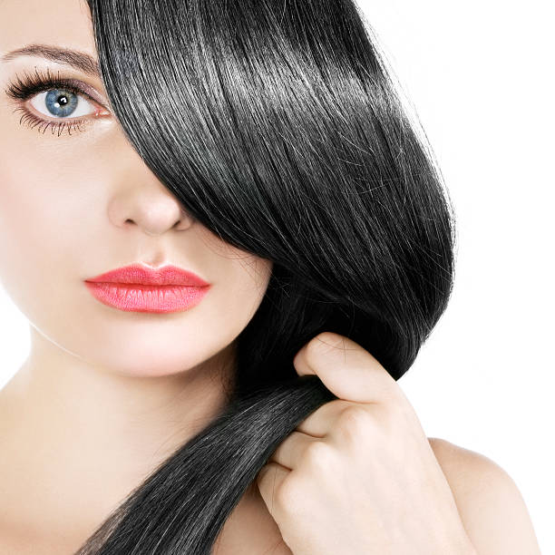 istock Women gently pulling her straight black hair over one eye 138179486