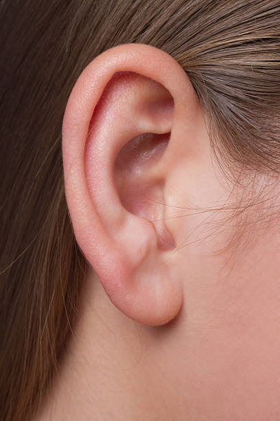 istock Young woman's ear close-up 138180042
