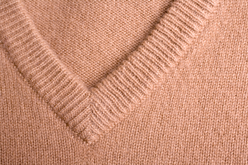 Detail of an v-neck cashmere pullover.