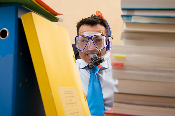 istock Businesman with books and  diving glasses 138182496