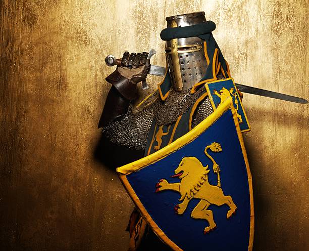 istock Medieval knight on golden background. 138185852