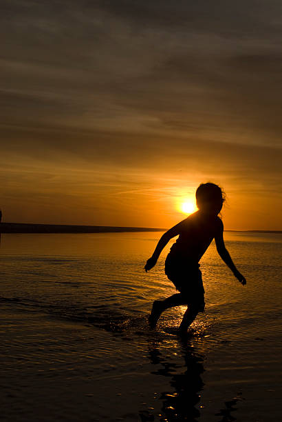 istock Sunset Silhouette Girl Running 138186748