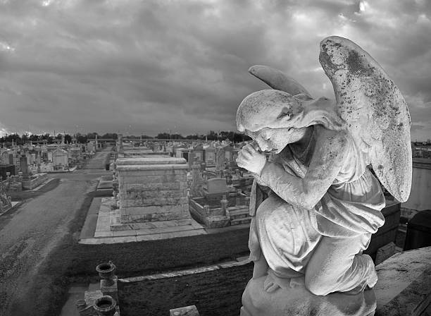 Praying Statue Cemeteryscape stock photo