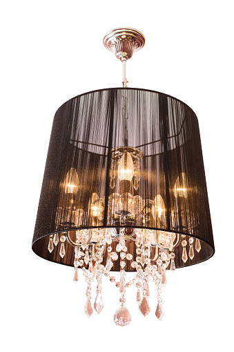 Beautiful black decoration lamp with arabic textures on a white striped ceiling.