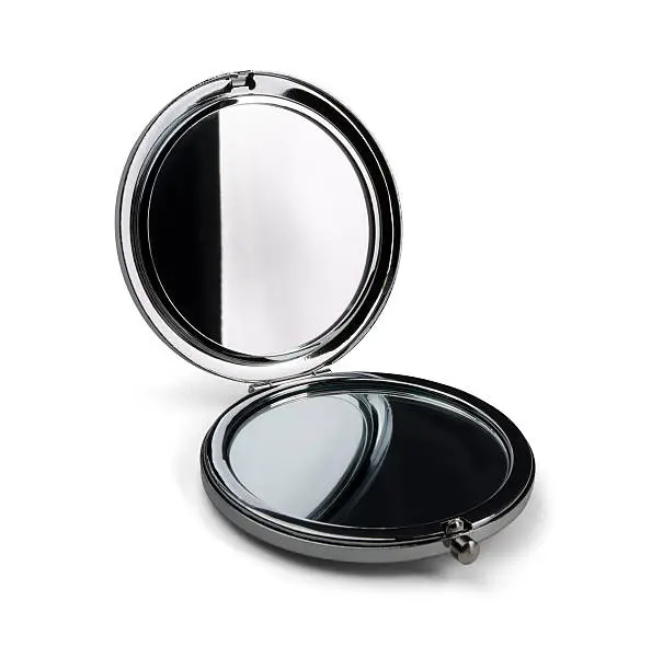 Pocket make-up mini mirror isolated on white