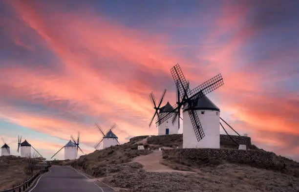 Consuegra windmills in Spain with dramatic sky.