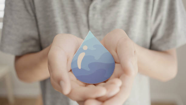 istock Hands holding water drop, world water day,  clean water and sanitation, hand sanitizer, CSR, save water, clean renewable energy, world water day concept 1381903708