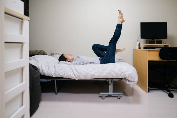 Young woman exercising on the bed