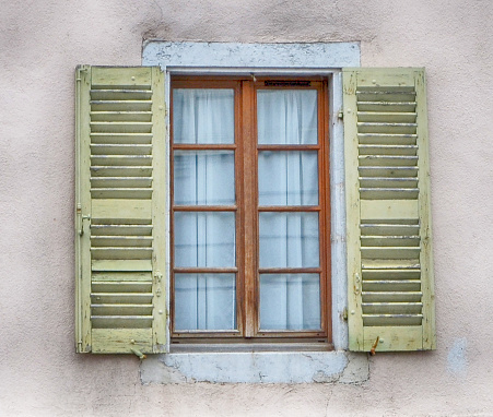 a close up of a window to rustic building