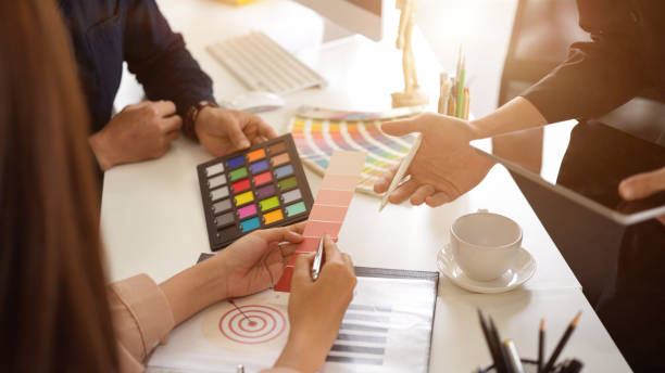 istock Group of designer are discussing and consulting their project 1381919944