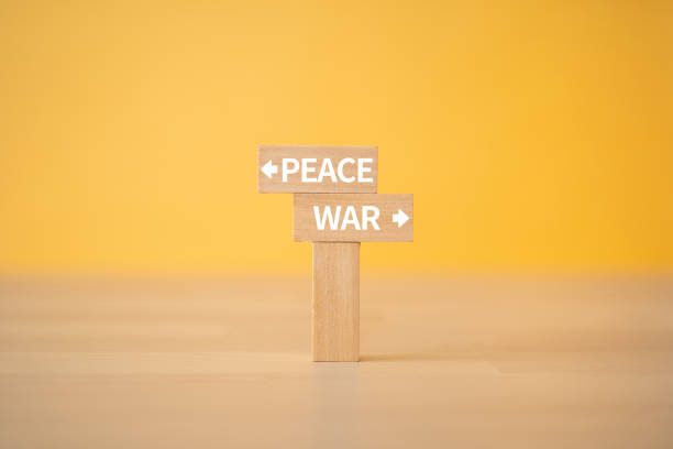Wooden blocks with "WAR" and "PEACE" text of concept. Wooden blocks with "WAR" and "PEACE" text of concept. peace demonstration stock pictures, royalty-free photos & images