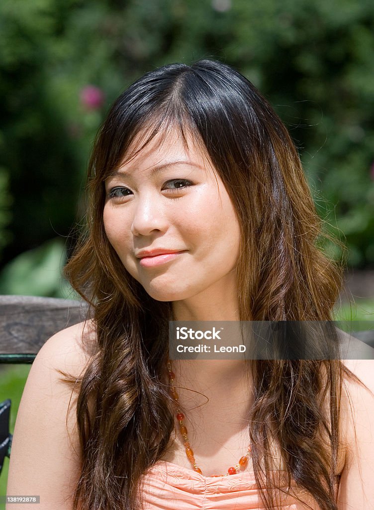 Beautiful girl Head and shoulders shot of a beautiful girl,nice and sharp without being unpleasant and nice background blue(Bokeh) Adult Stock Photo