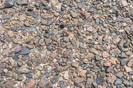 Desert pavement is a desert surface covered with closely packed, interlocking angular or rounded rock fragments of pebble and cobble size and found in Death Valley National Park, California. A single ventifact rock.
