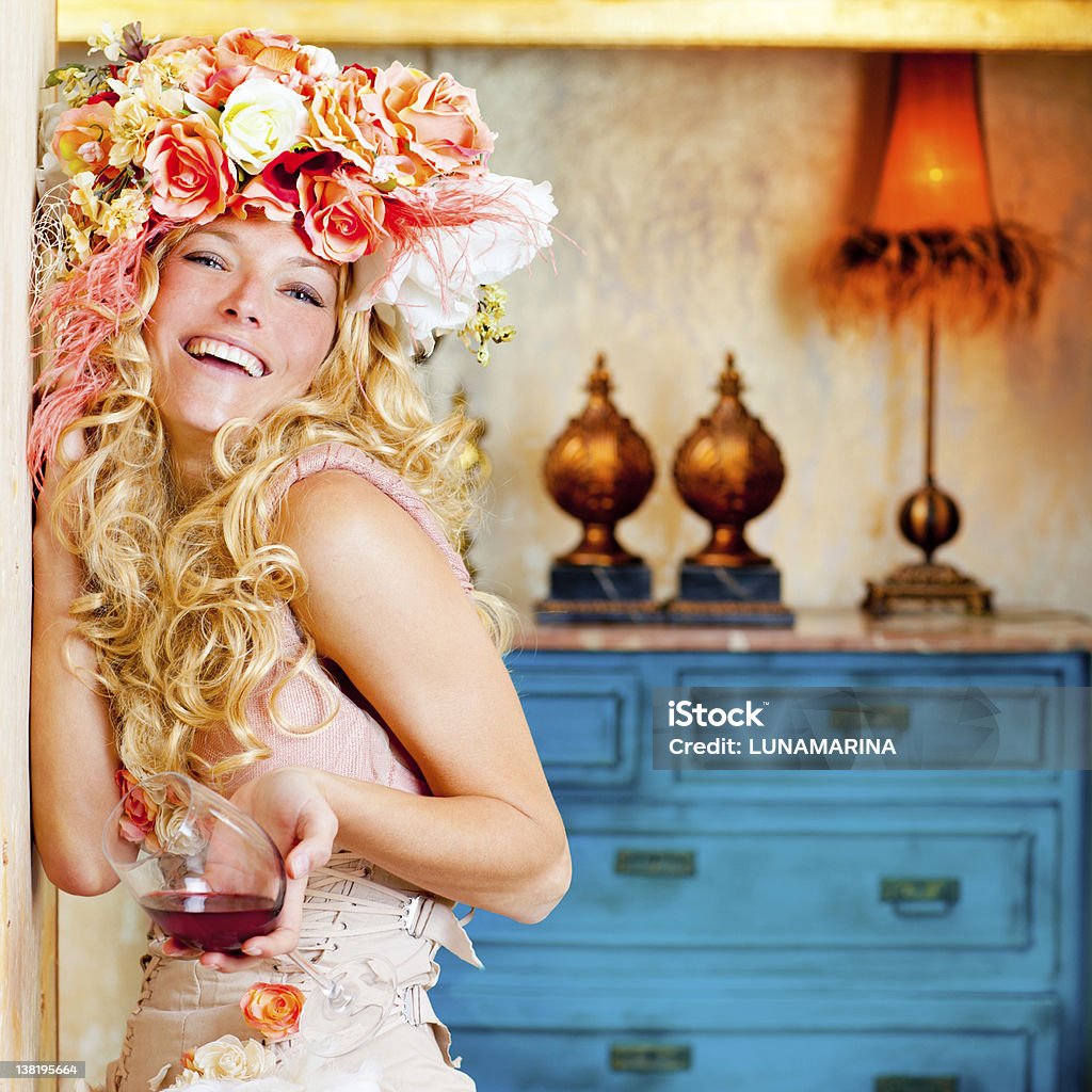 baroque fashion blond womand drinking red wine baroque fashion blond womand drinking red wine in grunge house Haute Couture Stock Photo