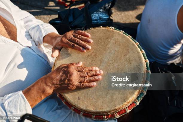 Hands Of An African American Man Playing Percussion With Djembe Drum Bongo Stock Photo - Download Image Now