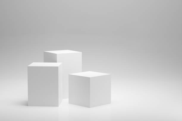 istock Blank white podium platforms or pedestals with white background for product display. 1381979225