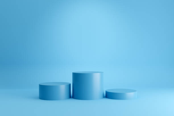 istock Winners podium or pedestal with empty cylindrical platforms on blue background. 1381984477