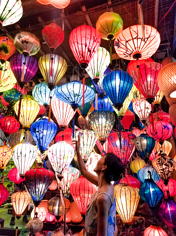 Asian Woman with beautiful lanterns in a night market in Da Nang, Vietnam