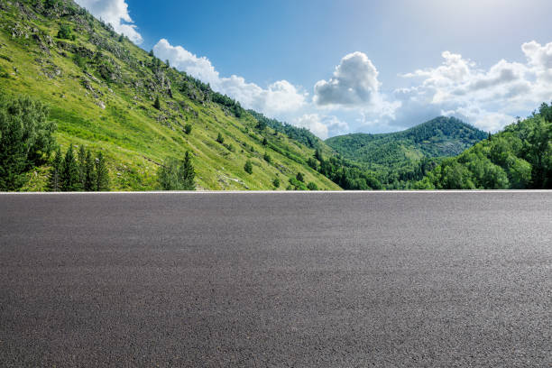 istock Asphalt road and mountains under blue sky 1381989702
