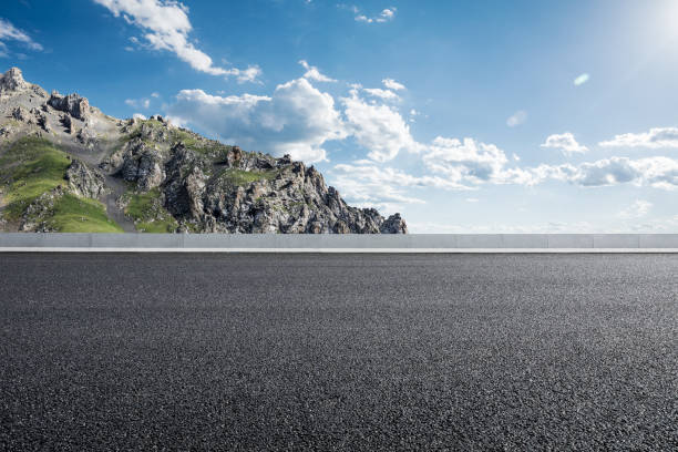istock Asphalt road and mountain background 1381990207