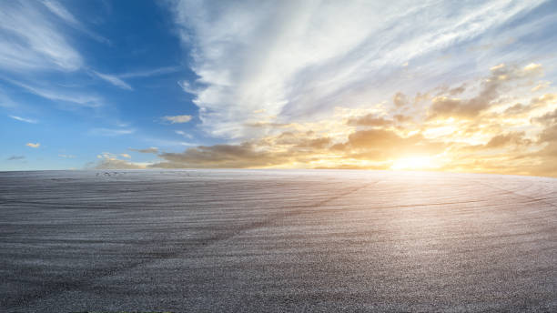 istock Asphalt road platform and sky cloud at sunset 1381997544